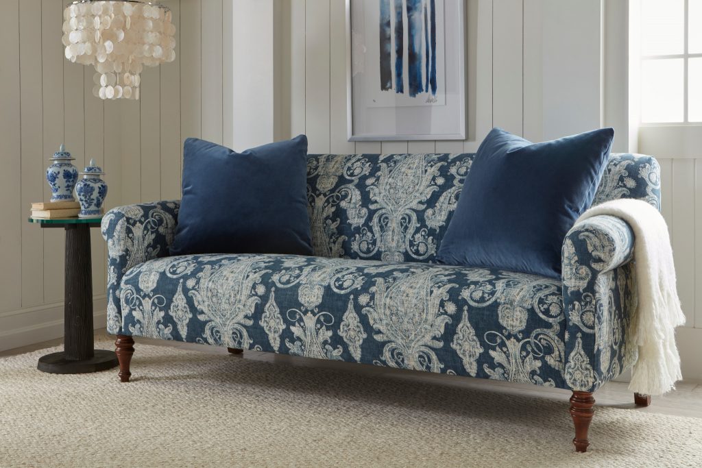 Transform your space by incorporating Classic Blue, the 2020 Pantone Color of the Year, with this upholstered sofa featuring a bold, blue print in plush velvet. 