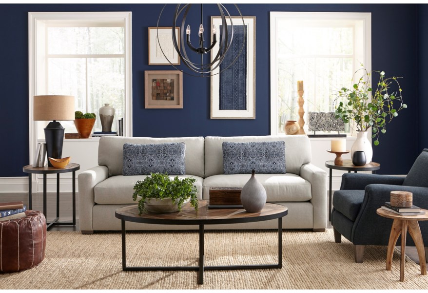 Make an impact in your Chattanooga living room with a white sofa to add contrast against a dark, moody wall.