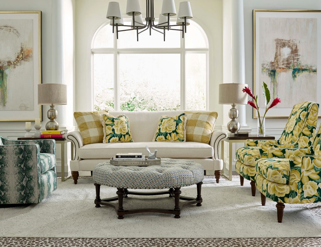 Dress up a white sofa with vintage patterns to create a mood in your Chattanooga living room.