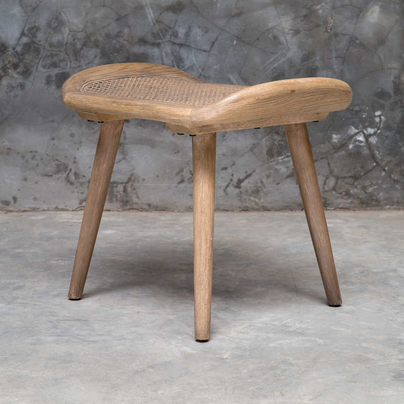 Scandinavian design also incorporates wood accents like this little stool by Uttermost.