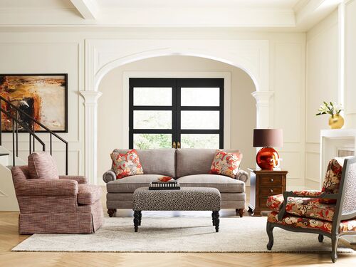 grey cloth kincaid sofa with floral and patterned accent chairs