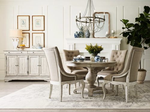 traditional furniture dining table with chairs and console table in the back.