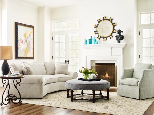 living room layout with sofa, ottoman, and accent chair
