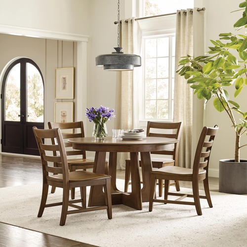 The Round Pedestal Table from the Kafe collection is great for a casual dining room look.