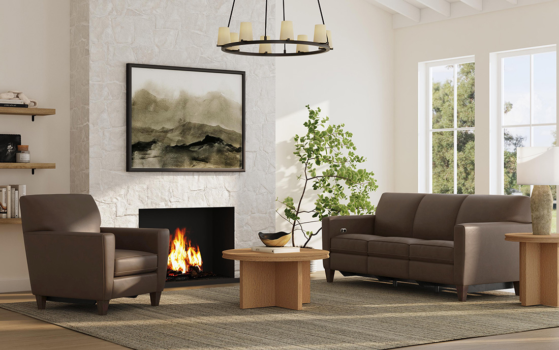 Timeless furniture in a modern living room featuring a leather Flexsteel sofa and armchair, wood coffee table, and neutral decor with a stone fireplace.