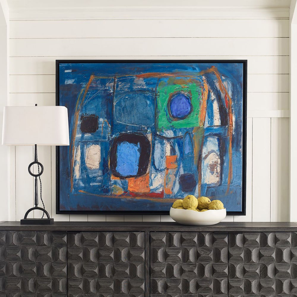 High-end home decor entryway featuring bold abstract artwork, a sculptural black lamp, textured dark wood console, and modern decorative bowl for a striking designer statement.
